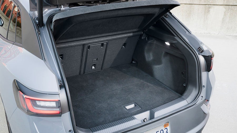 Image of a Arctic Blue ID.4 showing off its cargo space with the rear seats up.